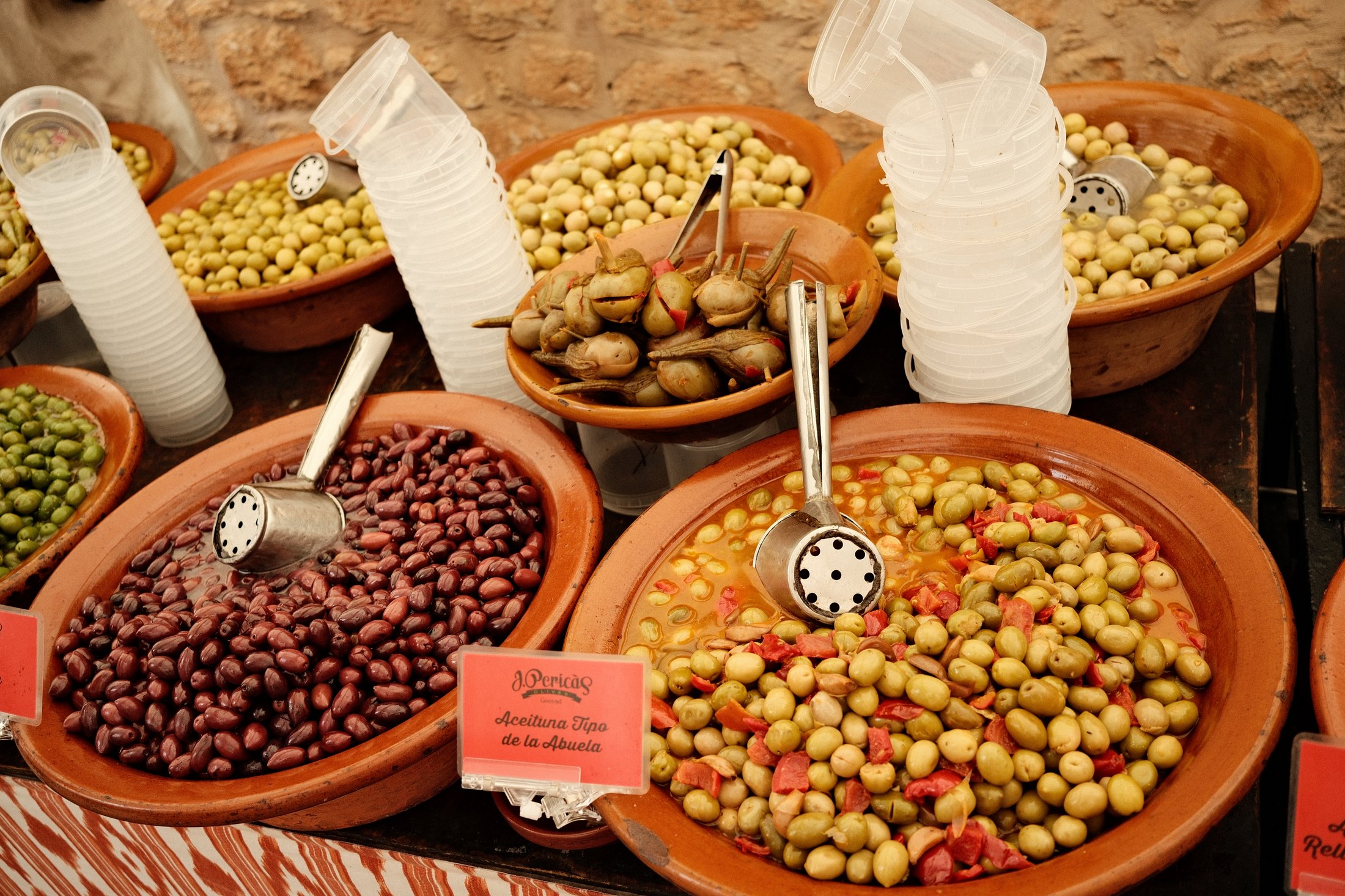 Bowls of olives at a market stall